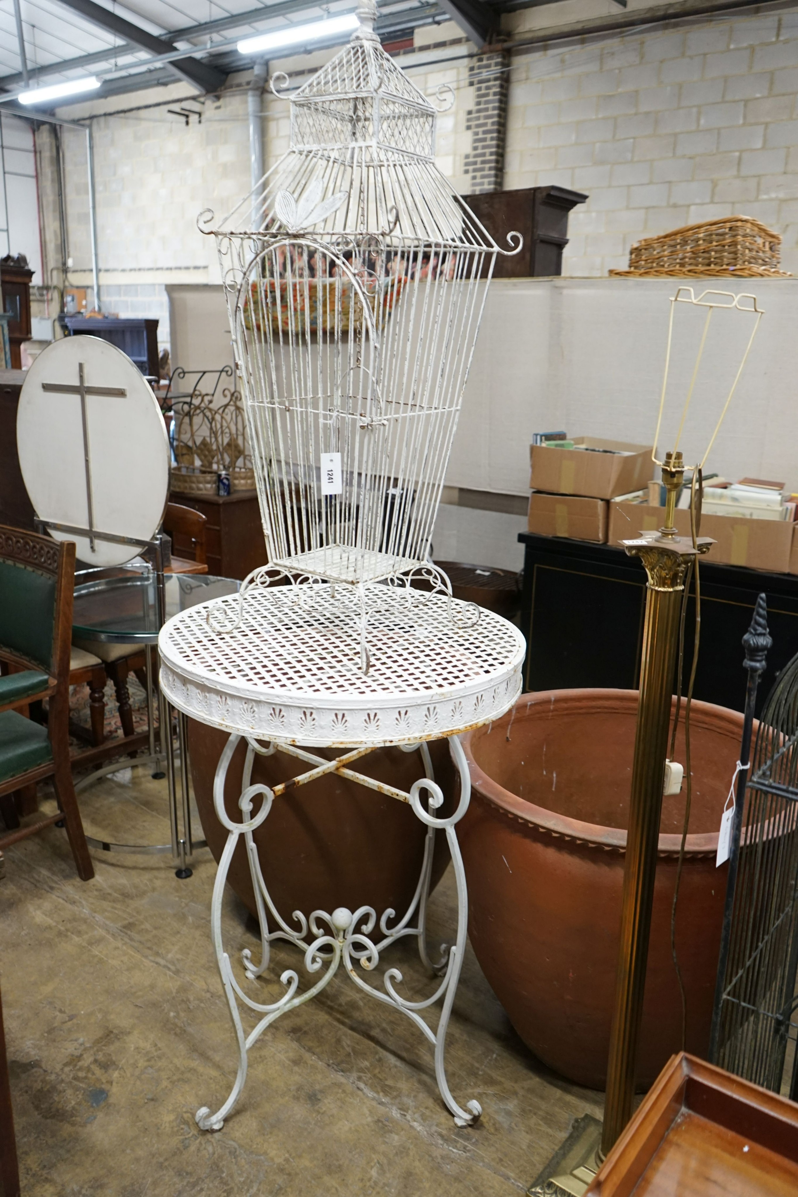 A white painted wirework birdcage, height 110cm together with a painted metal garden bar table